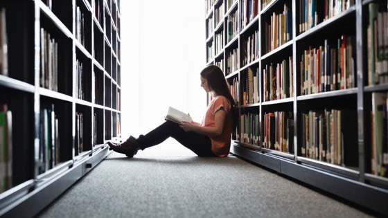 woman in library reading